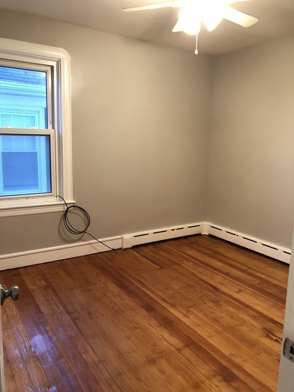 227 Ames Street Fall River, MA 02721 - Photo 7 of 18 a room with a hard wood floor and a window