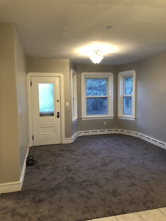 227 Ames Street Fall River, MA 02721 - Photo 8 of 18 an empty room with windows
