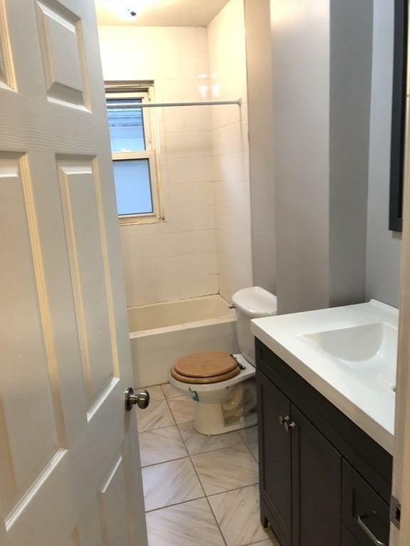 227 Ames Street Fall River, MA 02721 - Photo 9 of 18 a bathroom with a sink a toilet and shower