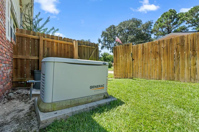 a front view of a house with yard and green space