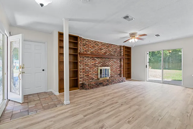 a view of a kitchen with wooden floor and a kitchen