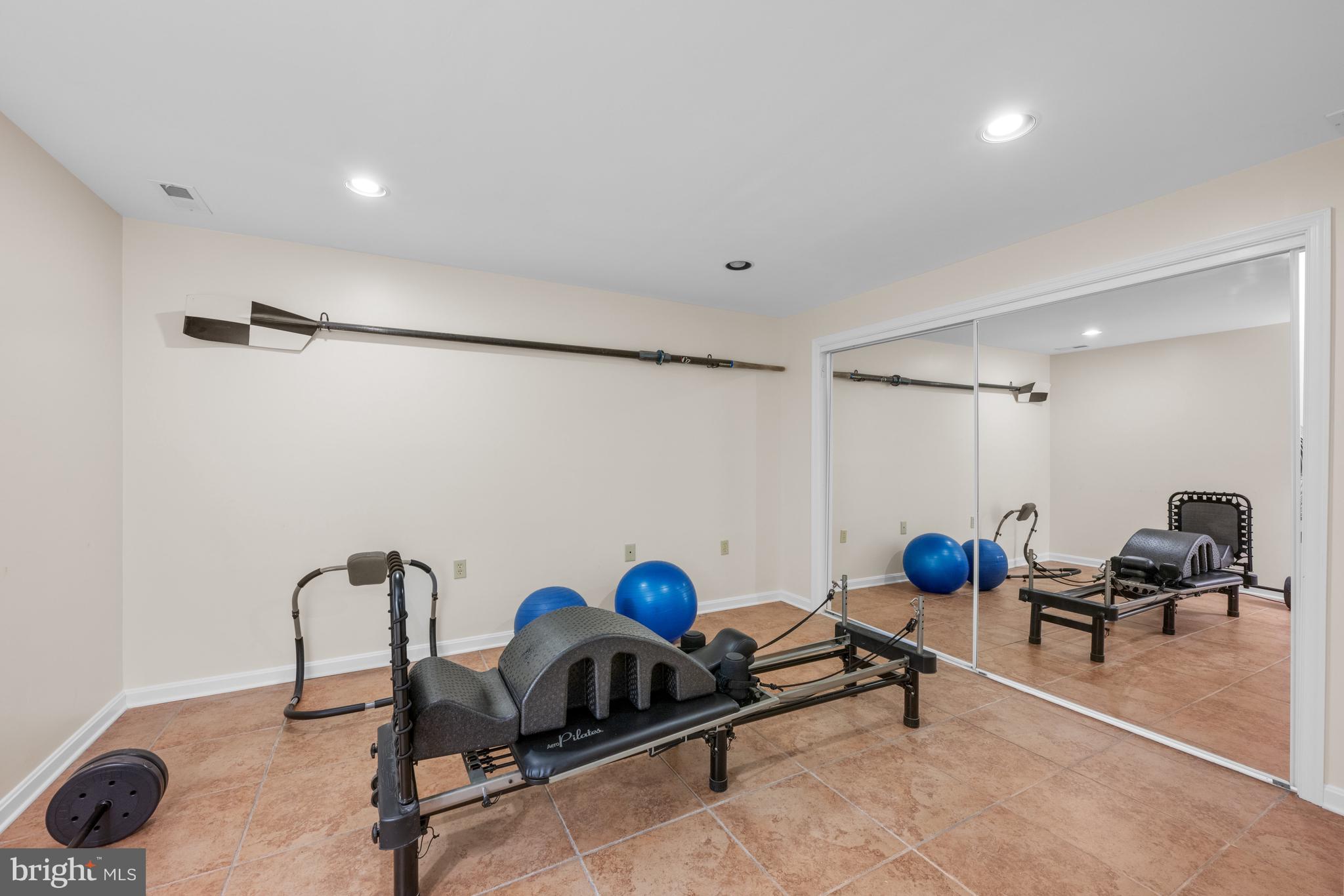 7708 Hackamore Drive Potomac, MD 20854 - Photo 26 of 34 a view of a room with gym equipment