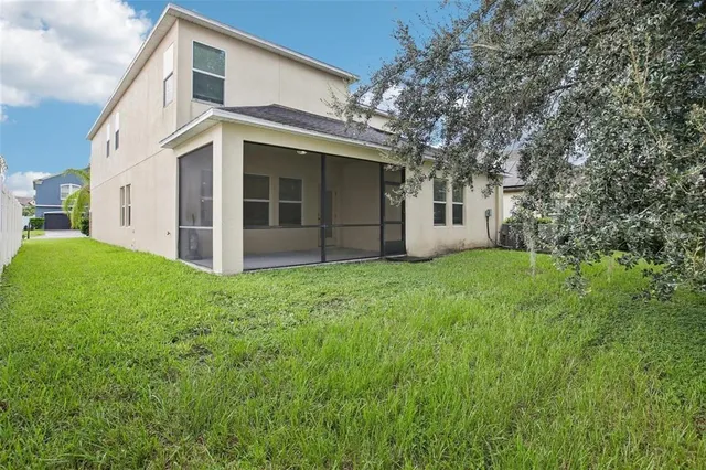 a view of a house with a yard