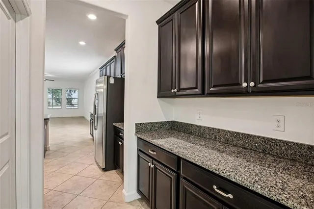 a kitchen with a refrigerator and countertop