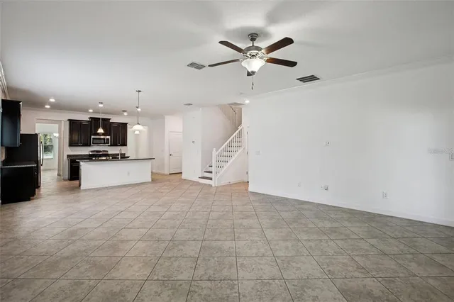 a view of a kitchen with a sink and a kitchen counter top space