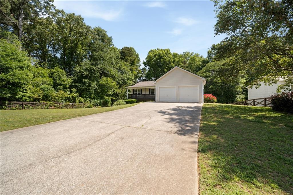 921 Pace Road Hiram, GA 30141 - Photo 1 of 41 a front view of a house with yard and green space