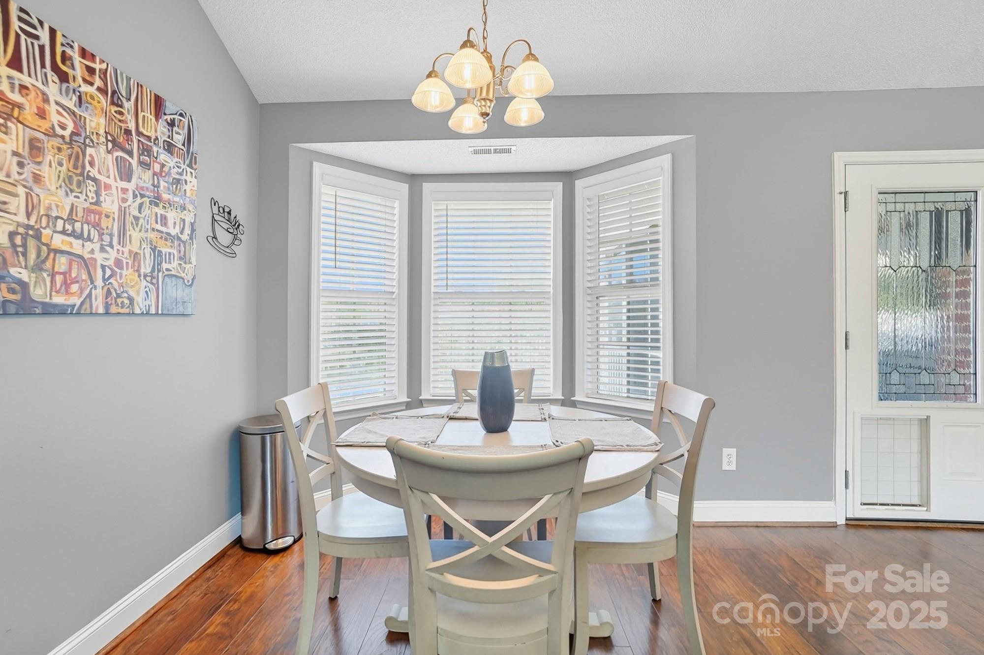 12639 Hill Pine Road Midland, NC 28107 - Photo 19 of 45 a view of a dining room with furniture window and wooden floor