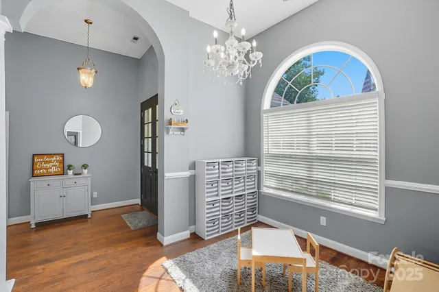 a view of an entryway with wooden floor