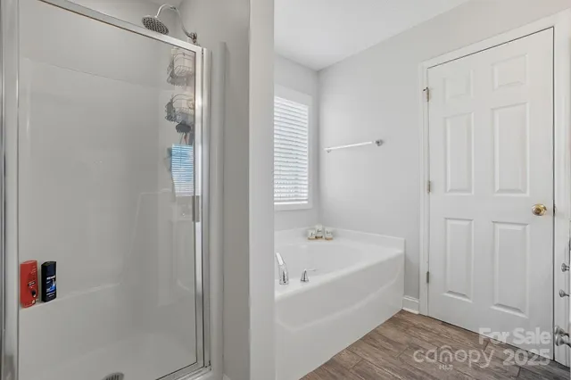 a white bath tub sitting next to a white tub