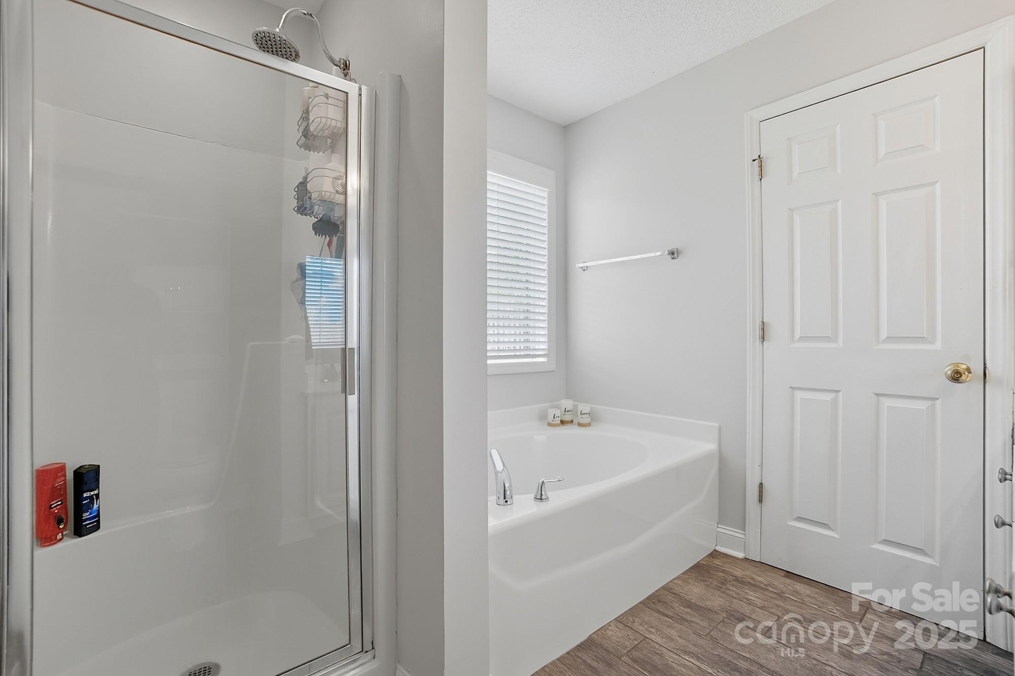 12639 Hill Pine Road Midland, NC 28107 - Photo 25 of 45 a white bath tub sitting next to a white tub