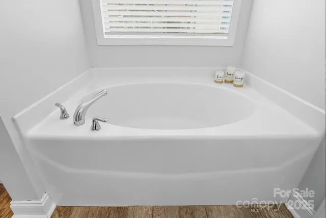a white bath tub sitting in a bathroom