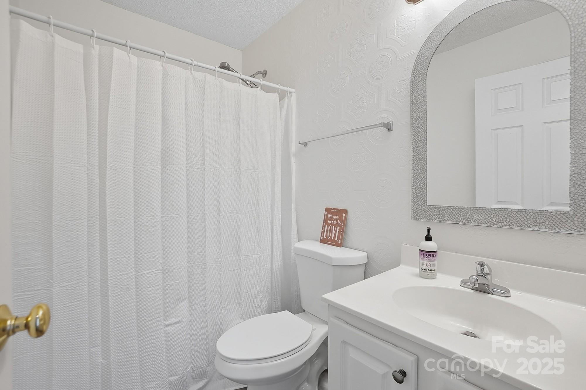 12639 Hill Pine Road Midland, NC 28107 - Photo 31 of 45 a bathroom with a sink toilet and shower
