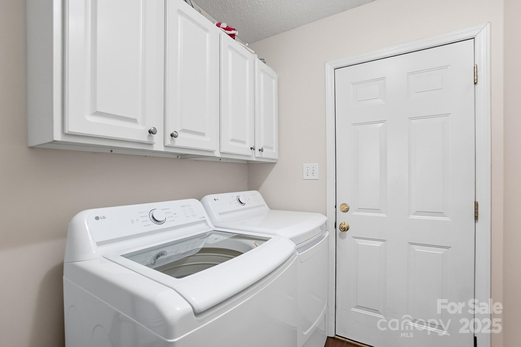 12639 Hill Pine Road Midland, NC 28107 - Photo 34 of 45 a utility room with dryer and washer
