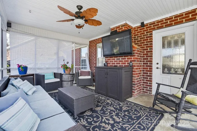 a living room with furniture and a flat screen tv