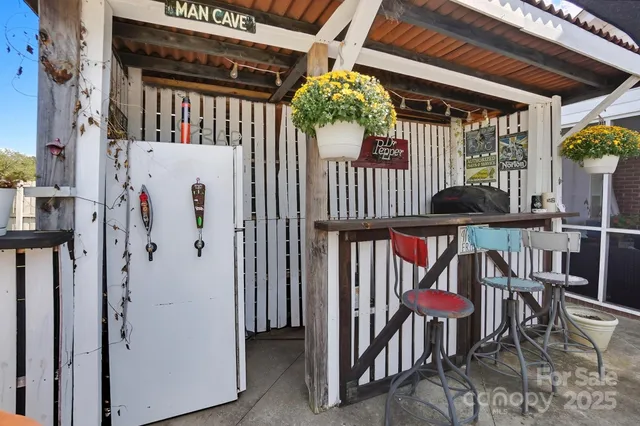 a view of a chairs and table in the balcony