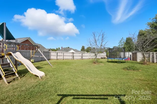 a view of a yard in front of a house with a yard