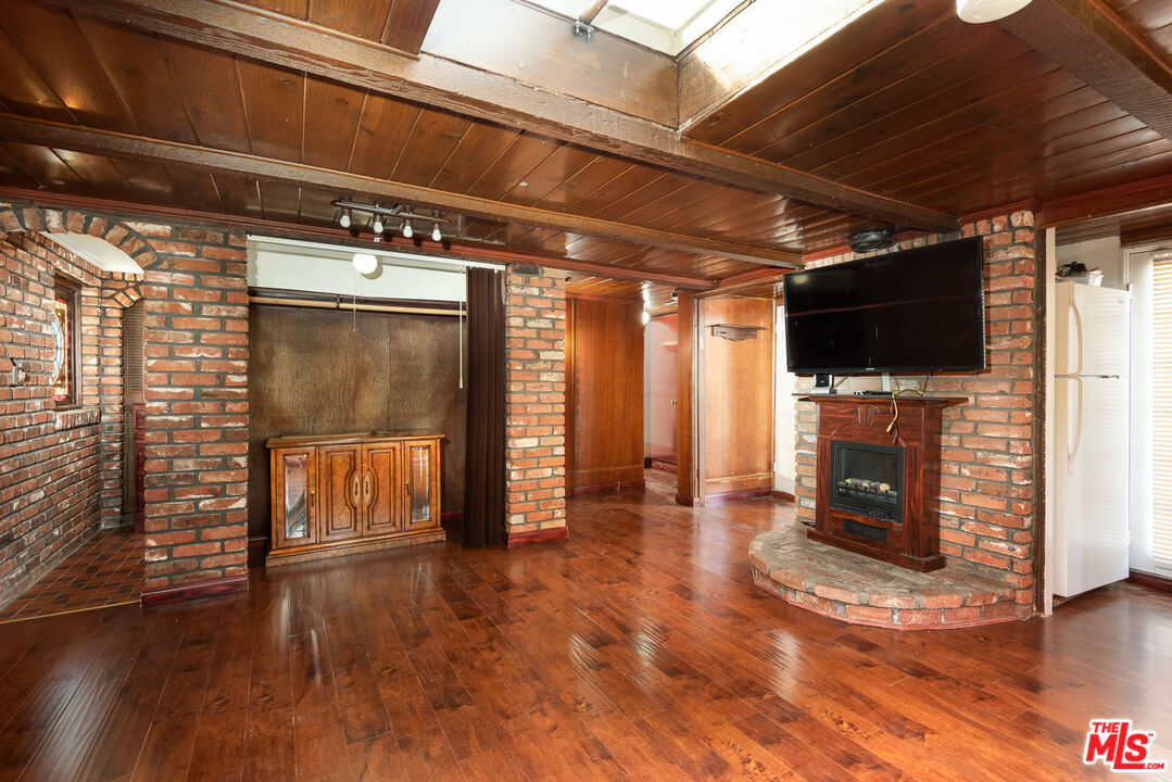 14842 Morrison Street Sherman Oaks, CA 91403 - Photo 13 of 41 a view of a livingroom with an empty space and a fireplace