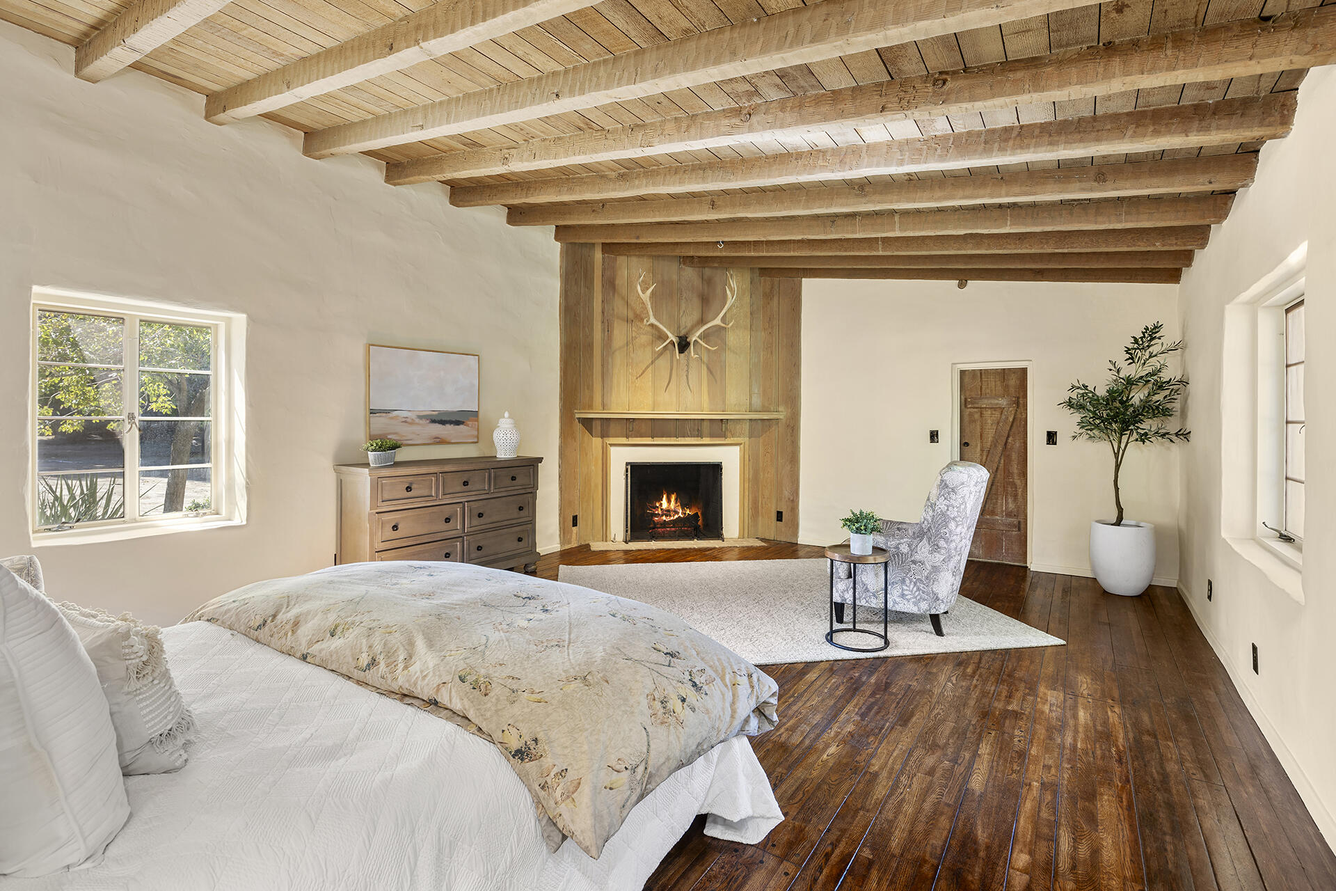71845 Sahara Road Rancho Mirage, CA 92270 - Photo 16 of 27 a spacious bedroom with a bed and wooden floor