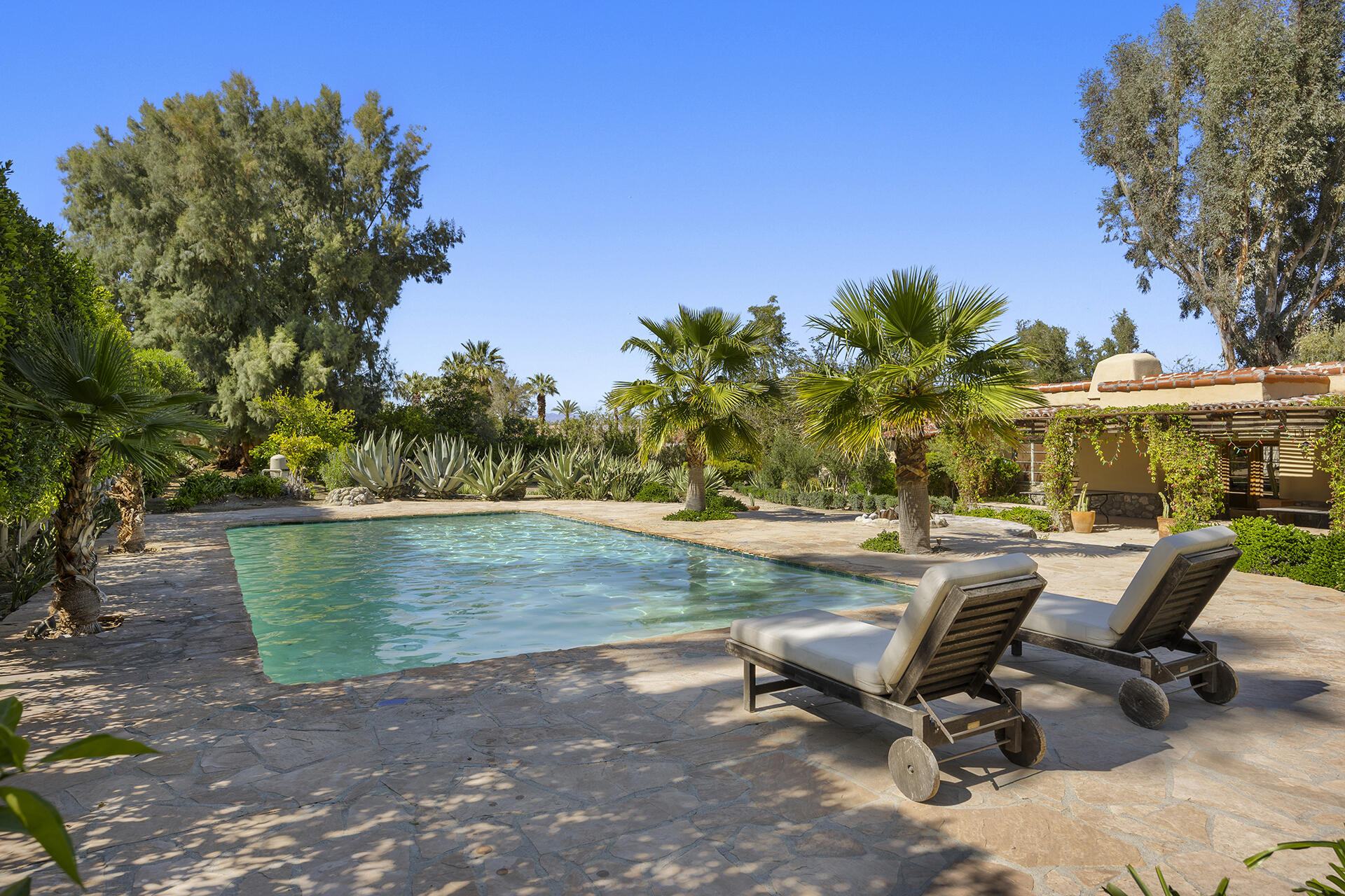 71845 Sahara Road Rancho Mirage, CA 92270 - Photo 23 of 27 a view of a swimming pool with a patio