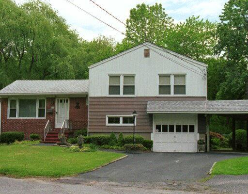7 Carol Place Riverside, CT 06878 - Photo 1 of 1 a view of a yard in front of house