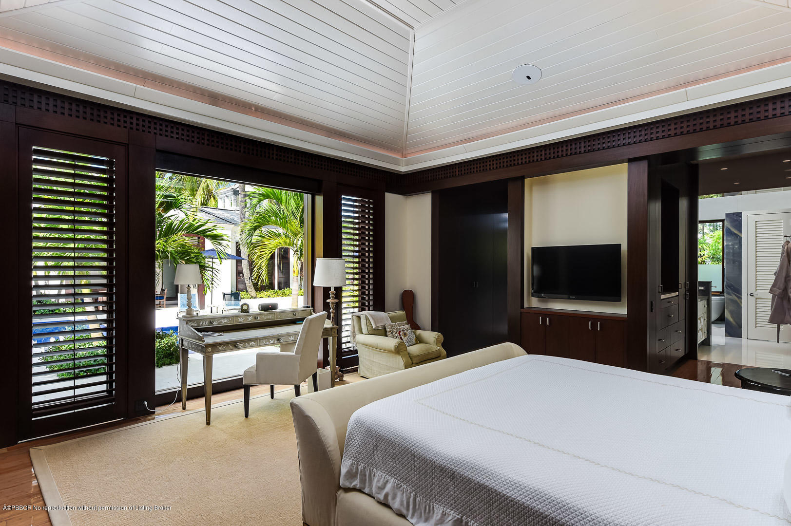 309 Garden Road Palm Beach, FL 33480 - Photo 14 of 26 a bedroom with a bed and large windows