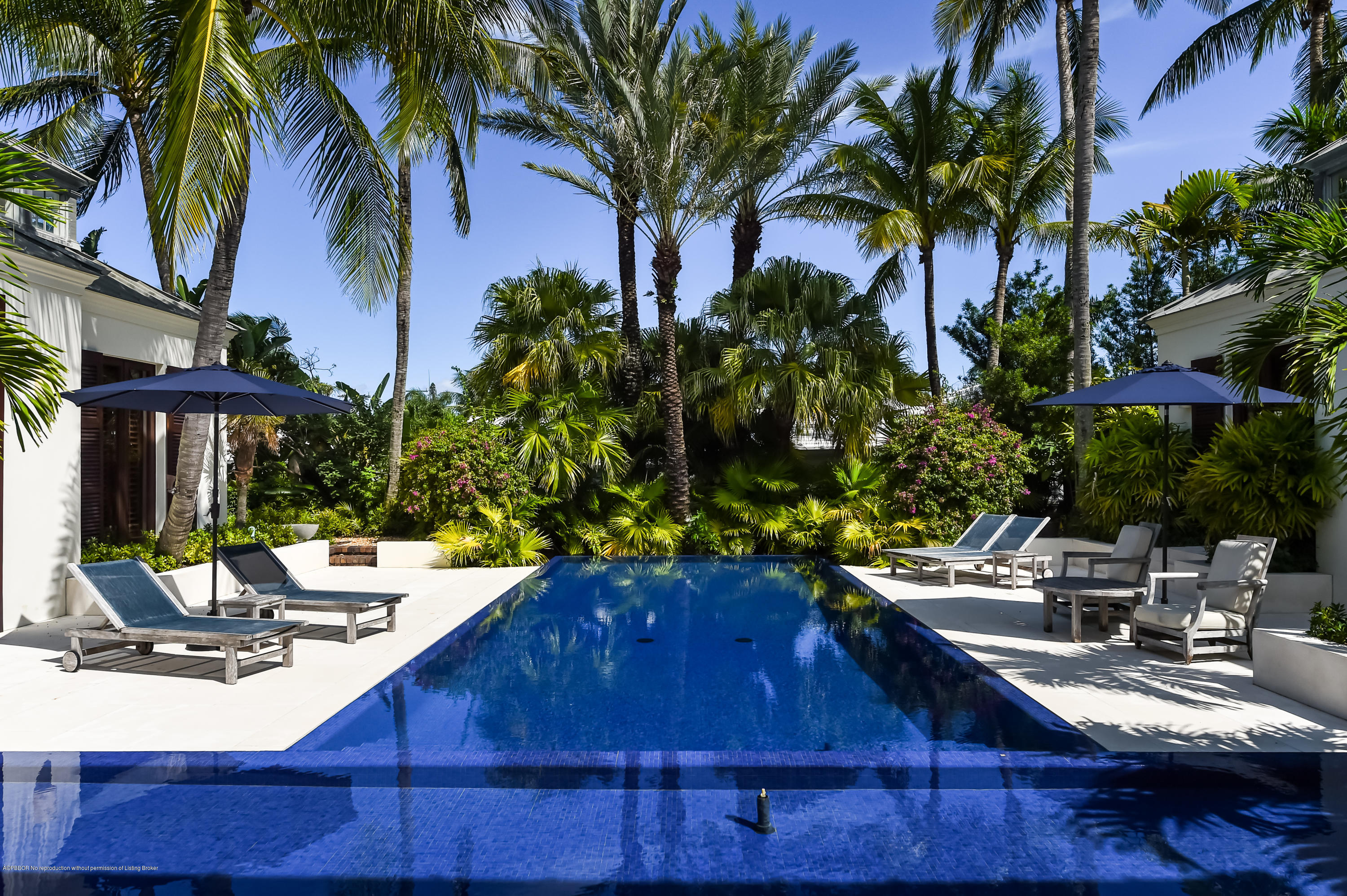 309 Garden Road Palm Beach, FL 33480 - Photo 20 of 26 a view of a backyard with plants and a patio