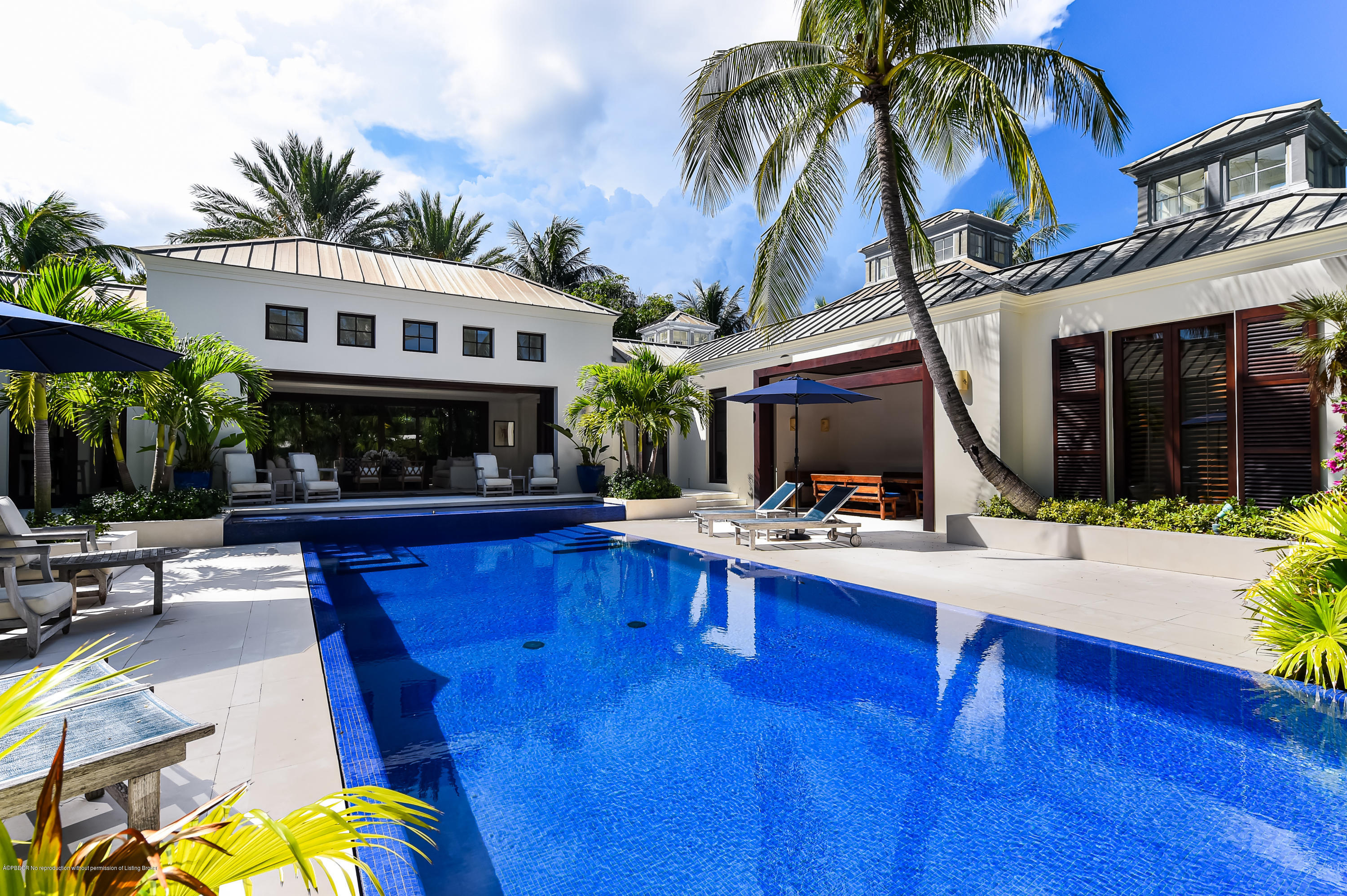 309 Garden Road Palm Beach, FL 33480 - Photo 21 of 26 a view of a house with swimming pool and sitting area