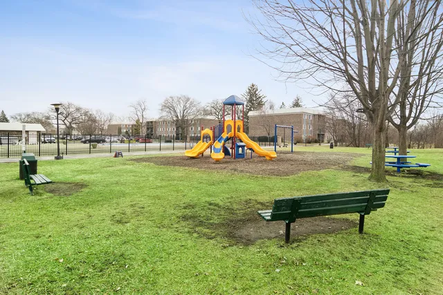 a park with bench and trees