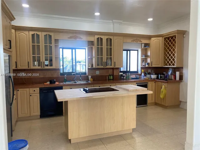 a kitchen with a stove and a refrigerator