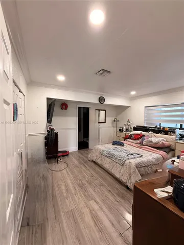 a room with furniture and a wooden floor