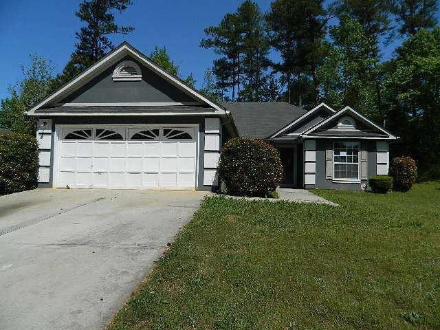 4946 Great Meadows Road Lithonia, GA 30038 - Photo 1 of 1 a front view of a house with a yard and garage
