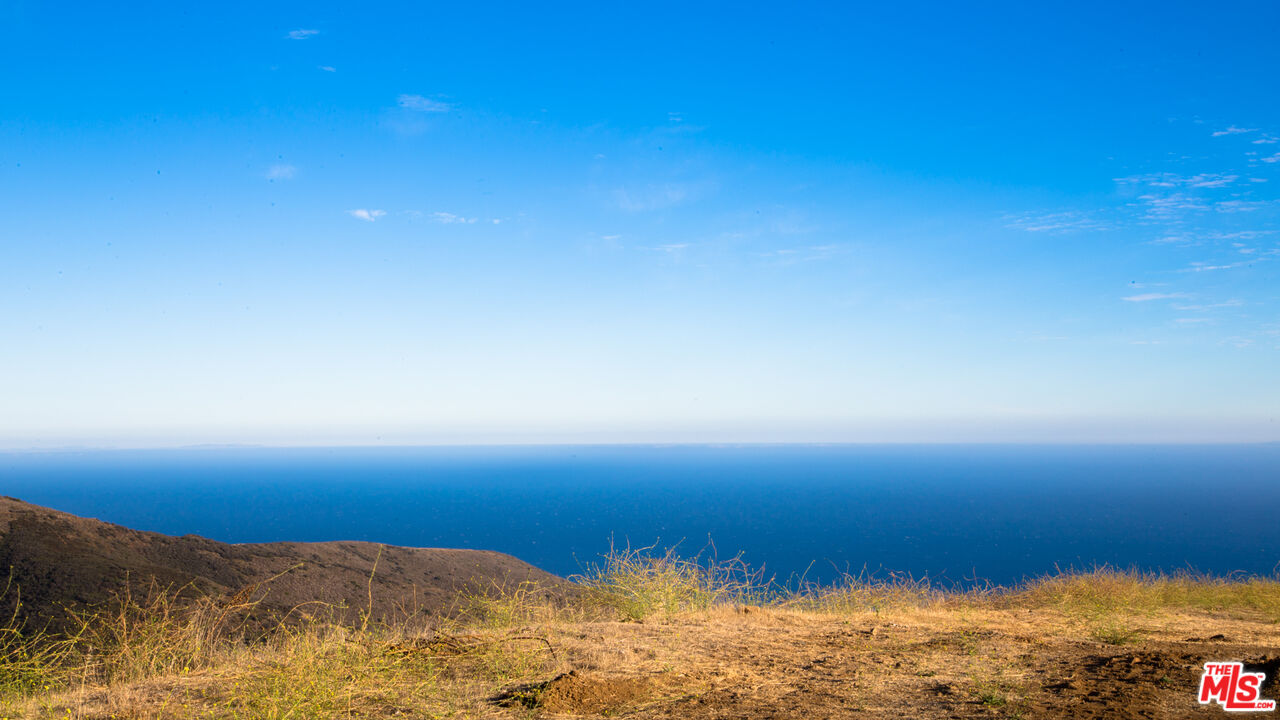 9950 Cotharin Road Malibu, CA 90265 - Photo 32 of 48 a view of ocean and sunset