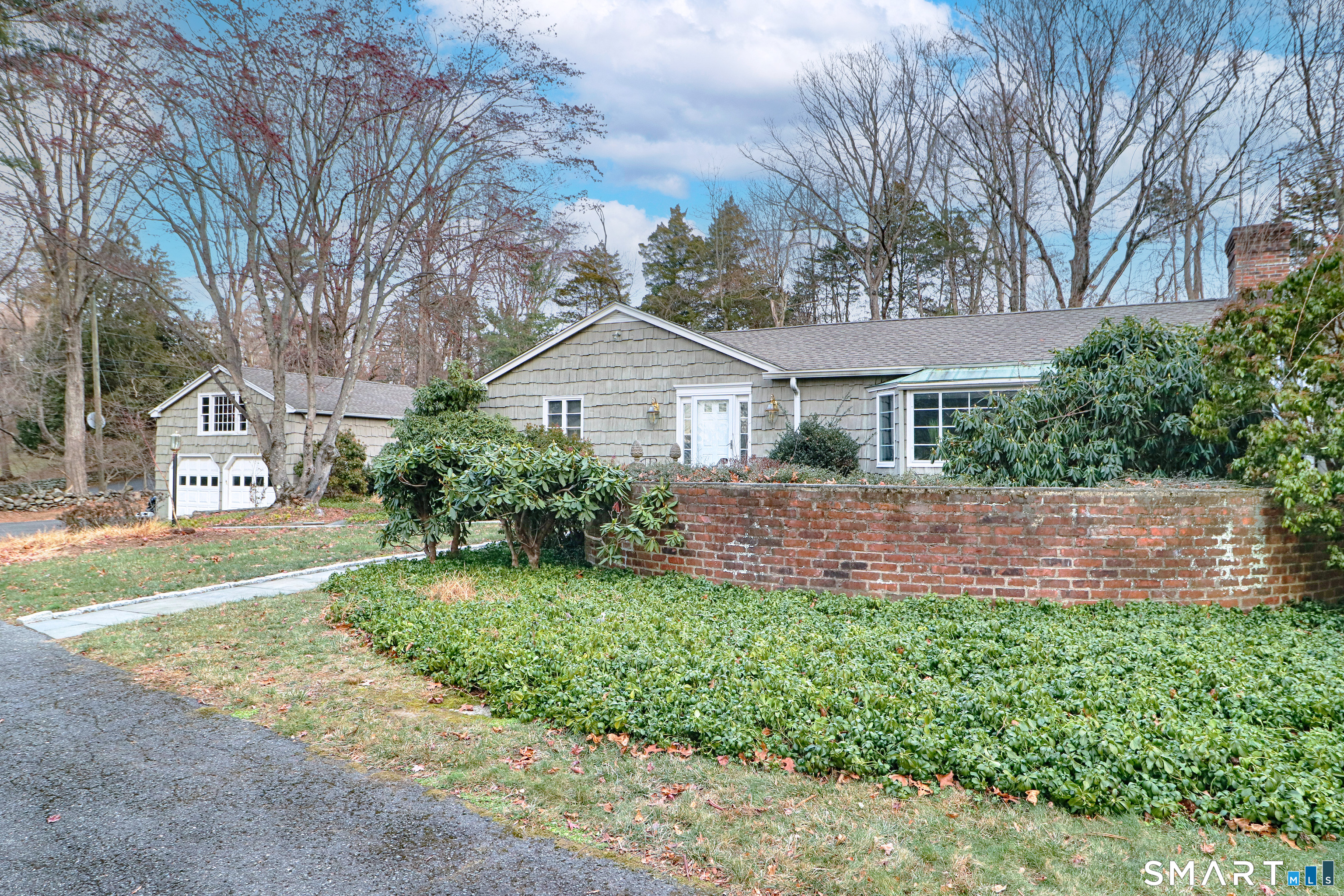 5 Over Rock Lane Westport, CT 06880 - Photo 2 of 28 Front close up featuring Belgian block lined walkways and front garden surrounded by a curved brick wall.