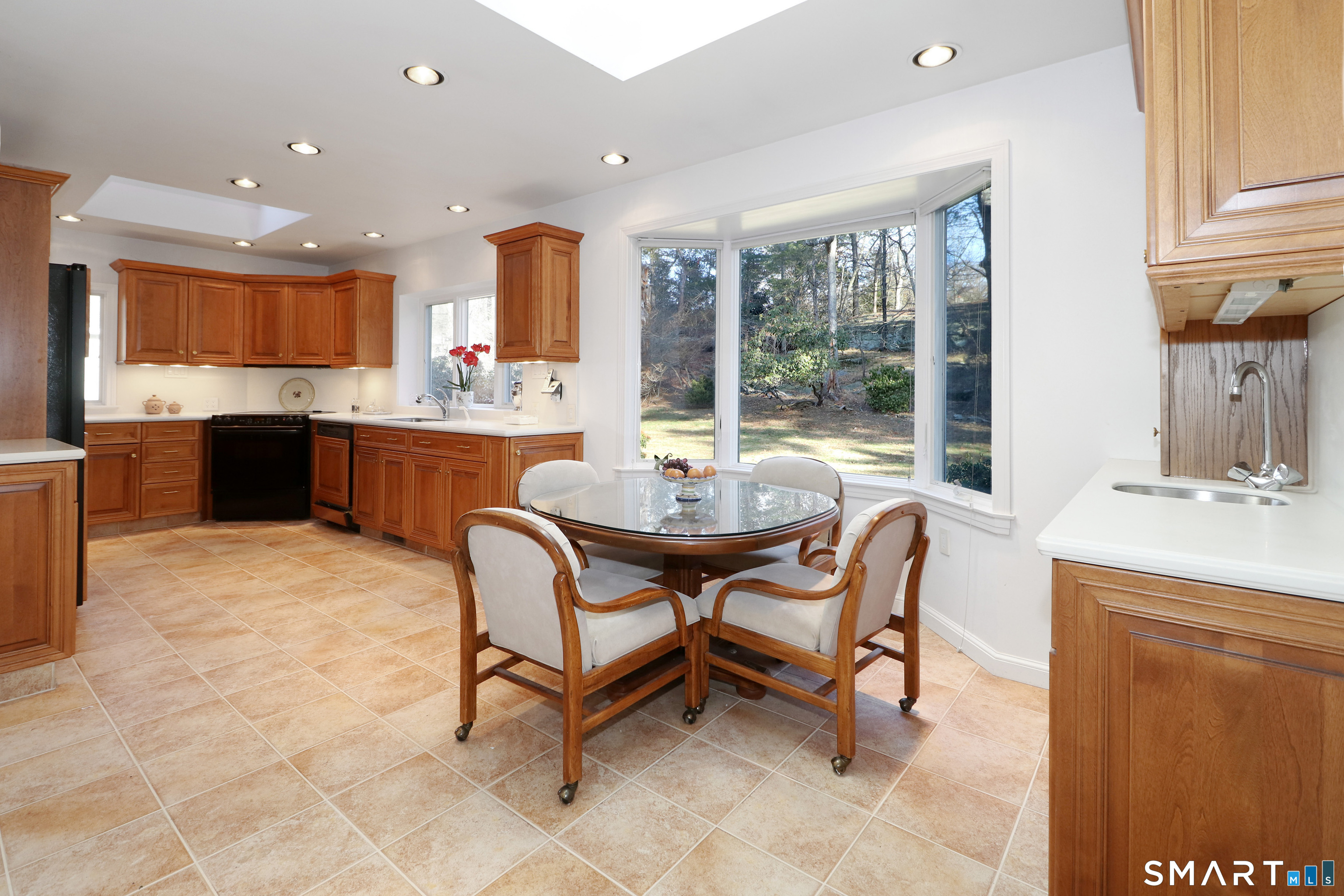 5 Over Rock Lane Westport, CT 06880 - Photo 10 of 28 Large eat-in-kitchen with wet bar and dining nook with bay window overlooking rear grounds.