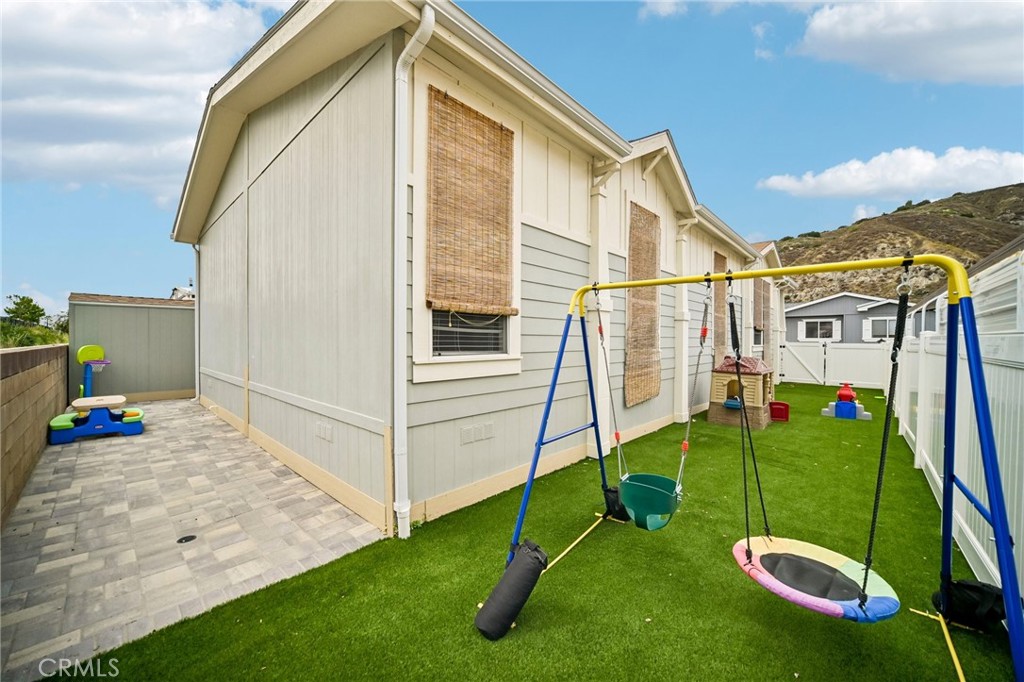 250 East Telegraph Road, Unit 307 Fillmore, CA 93015 - Photo 35 of 36 a view of a house with a backyard