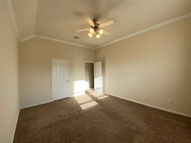 a view of a livingroom with a ceiling fan and window