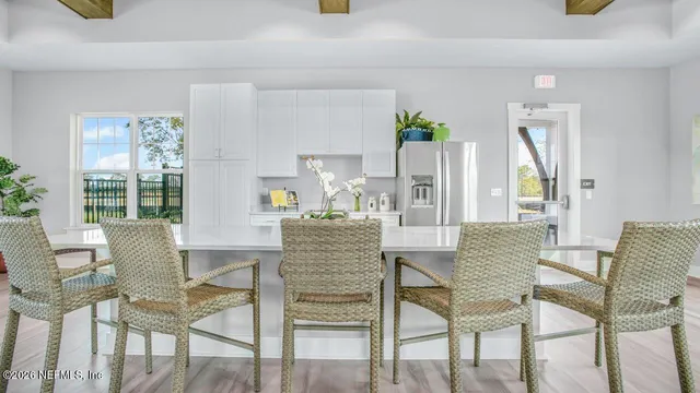 a living room with furniture and a lamp