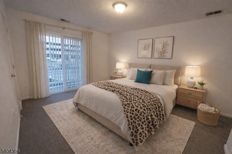 1 Rutgers Drive Newark, NJ 07103 - Photo 2 of 2 a bedroom with a large bed and a window