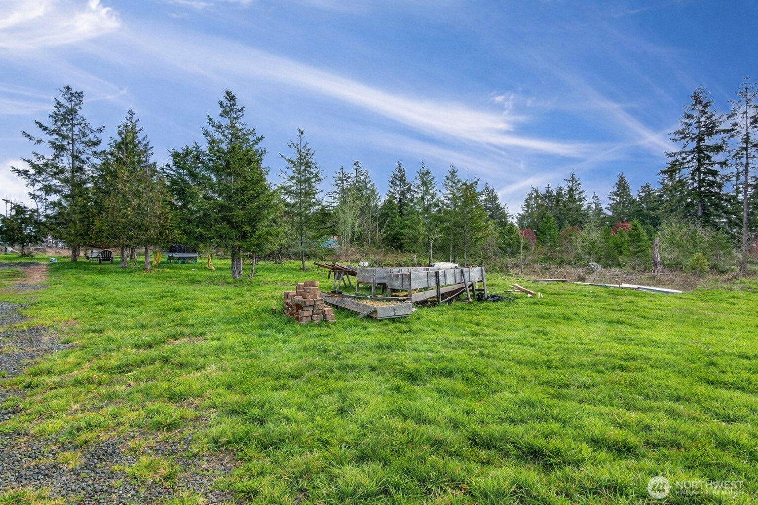 1369 Centralia Alpha Road Chehalis, WA 98532 - Photo 17 of 18 a backyard of a house with table and chairs