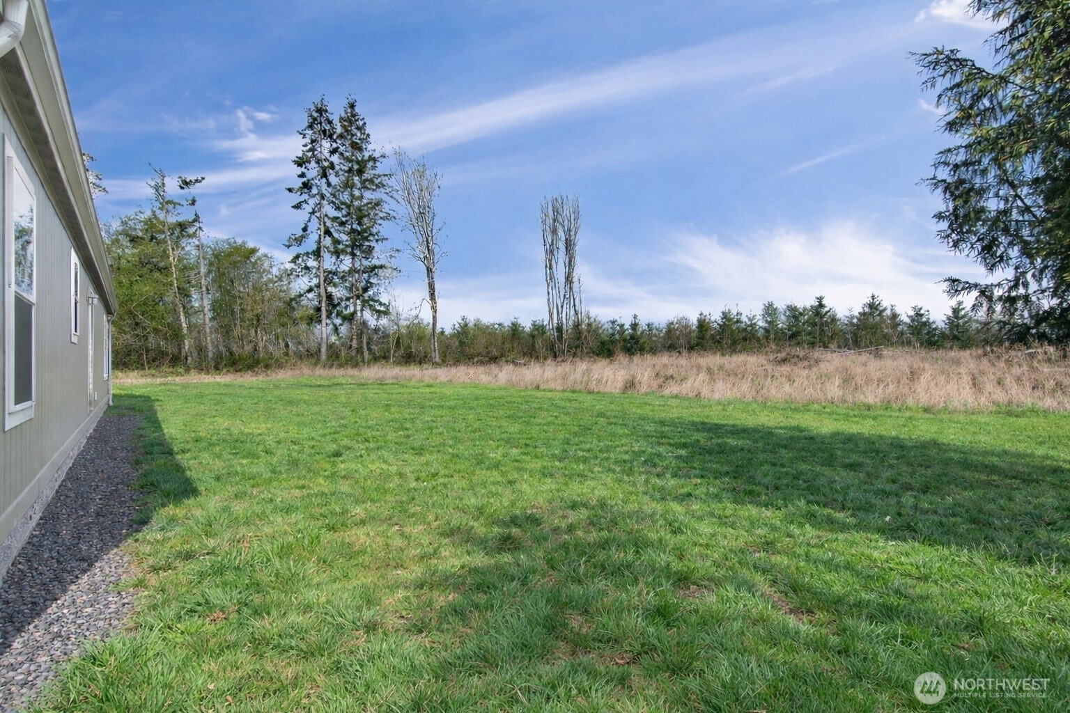 1369 Centralia Alpha Road Chehalis, WA 98532 - Photo 18 of 18 a view of a lake with houses in the back