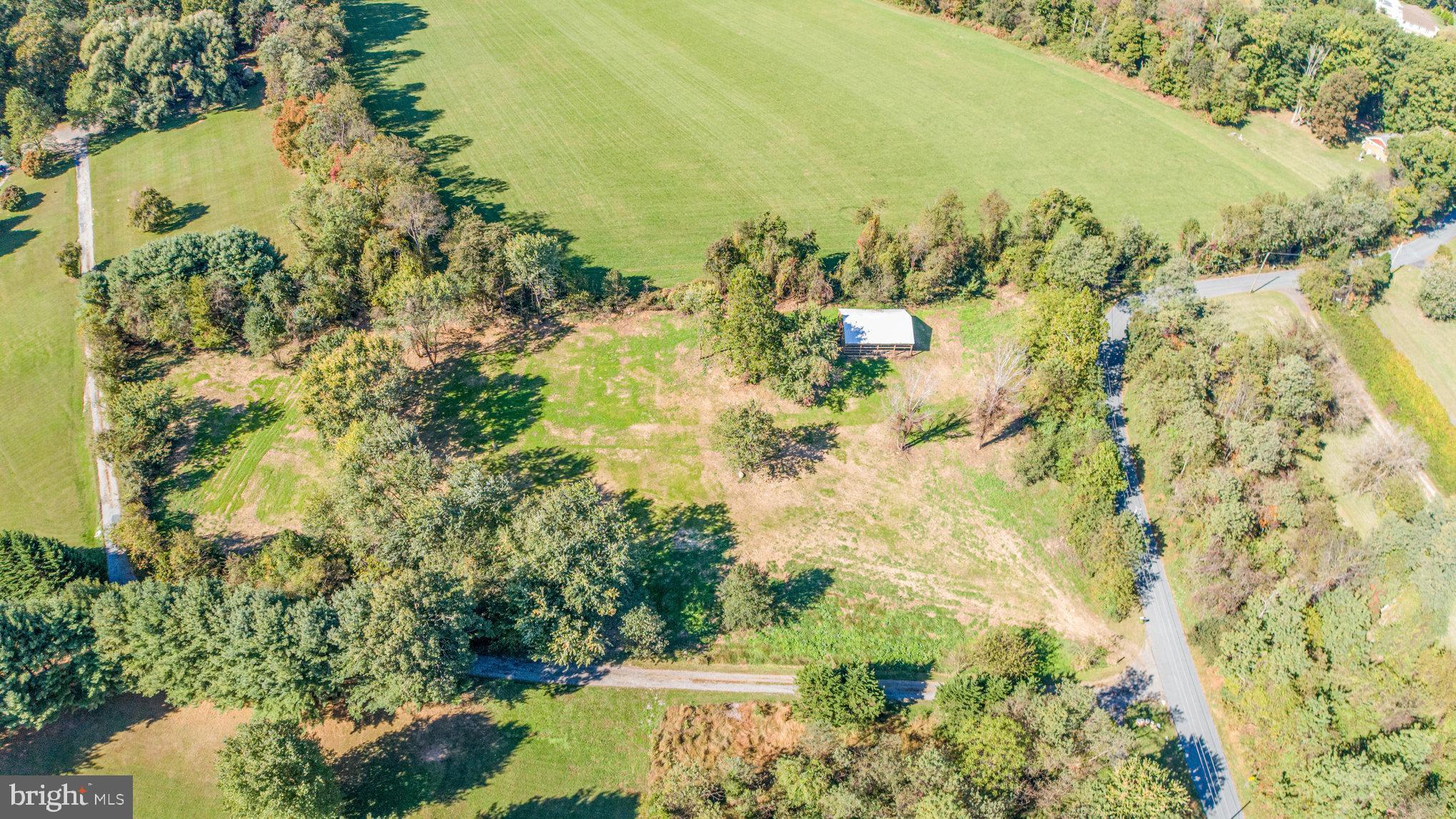 3756 Davis Corner Road Street, MD 21154 - Photo 2 of 11 a view of a lake with a yard
