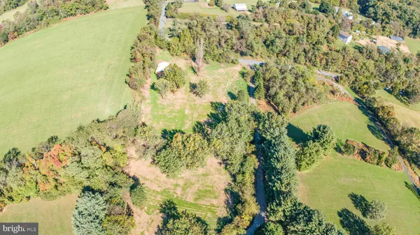 a view of a lake with a yard