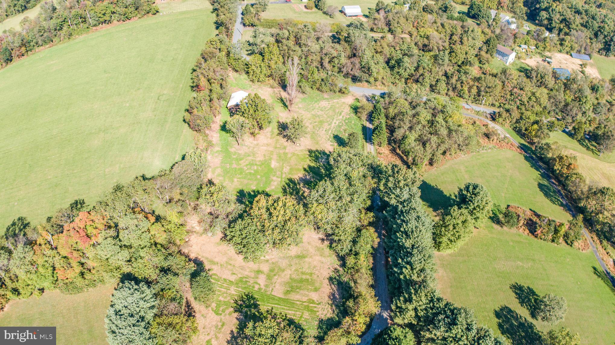 3756 Davis Corner Road Street, MD 21154 - Photo 3 of 11 a view of a lake with a yard