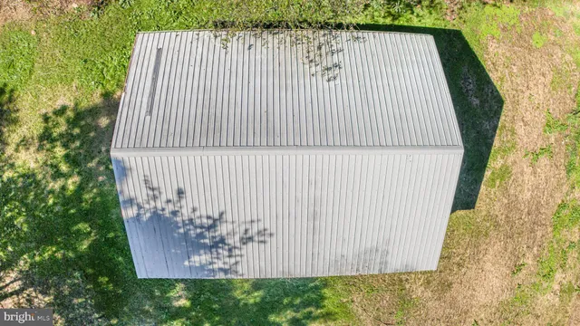 front view of a house with a large window