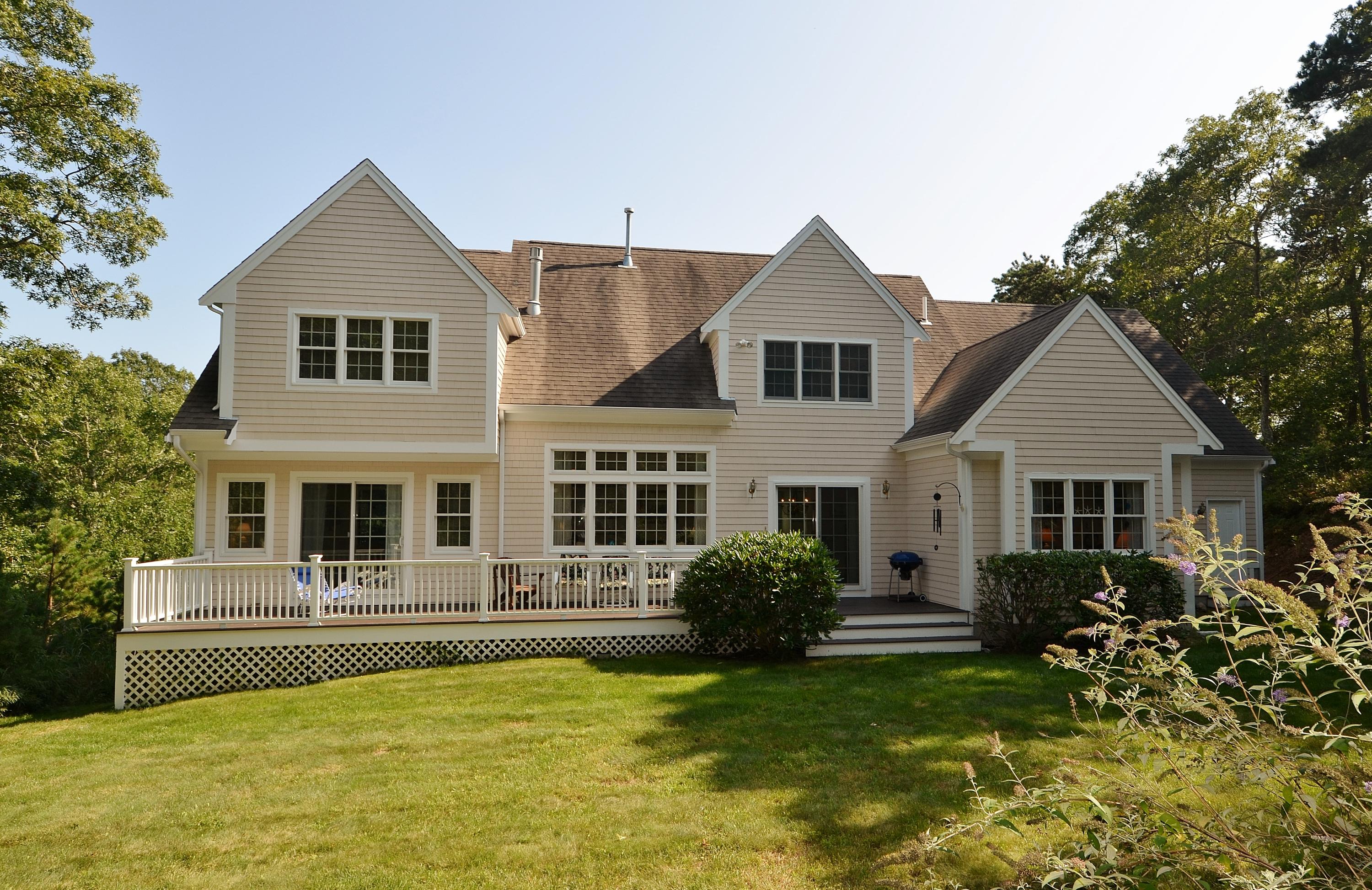 121 Cairn Ridge Road East Falmouth, MA 02536 - Photo 22 of 28 a front view of house with yard and green space