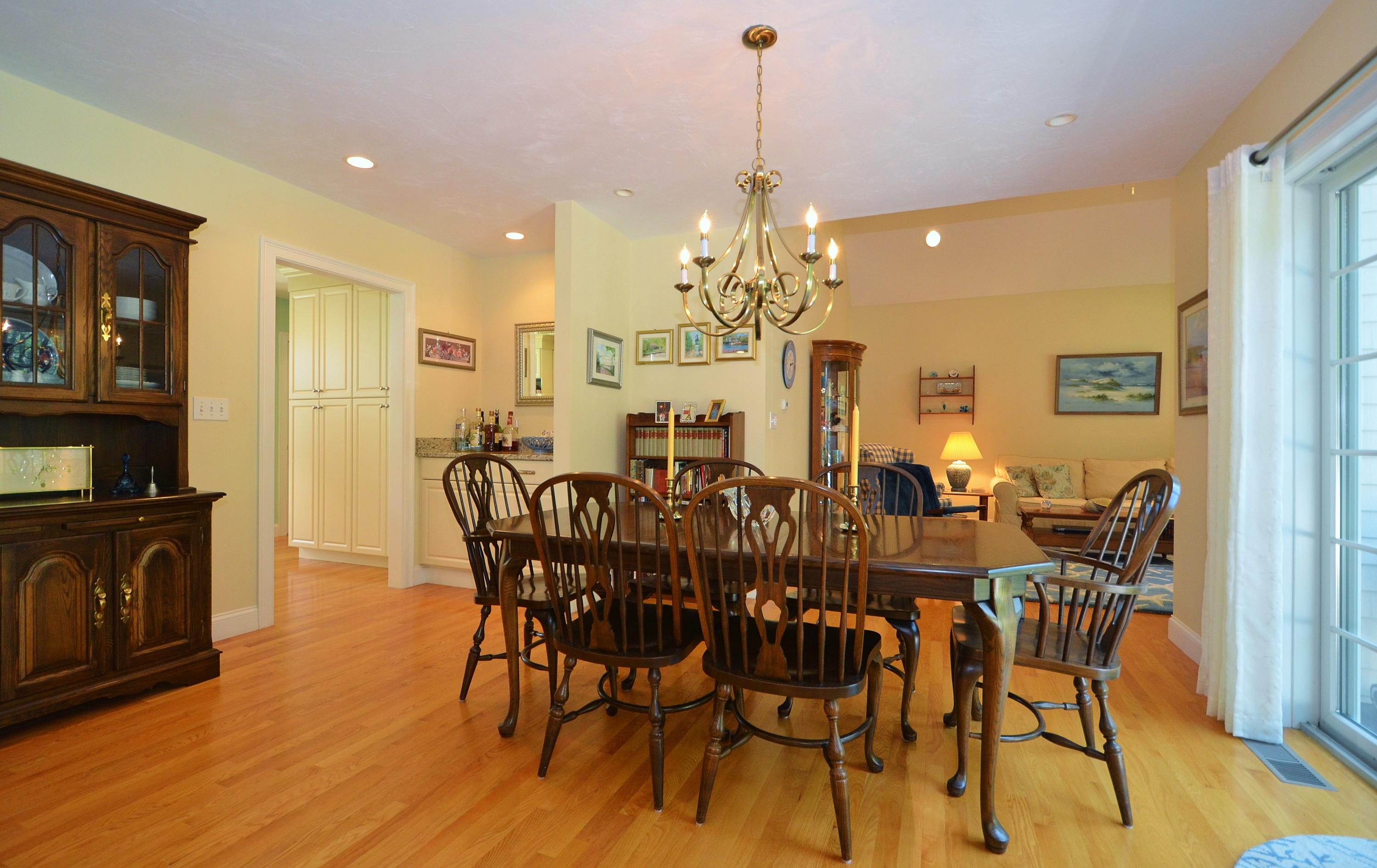 121 Cairn Ridge Road East Falmouth, MA 02536 - Photo 5 of 28 a view of a dining room with furniture and wooden floor