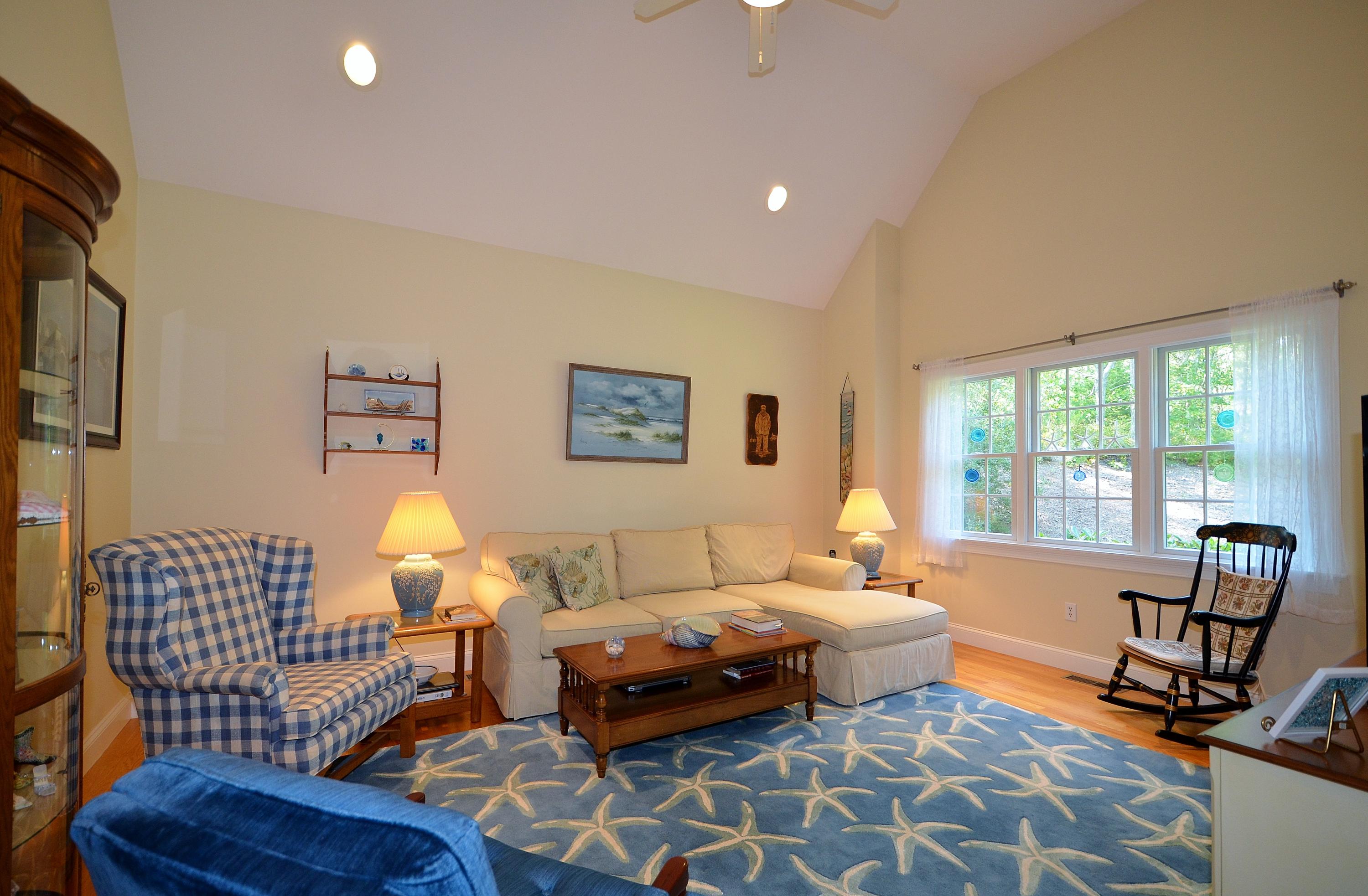 121 Cairn Ridge Road East Falmouth, MA 02536 - Photo 7 of 28 a living room with furniture and a flat screen tv