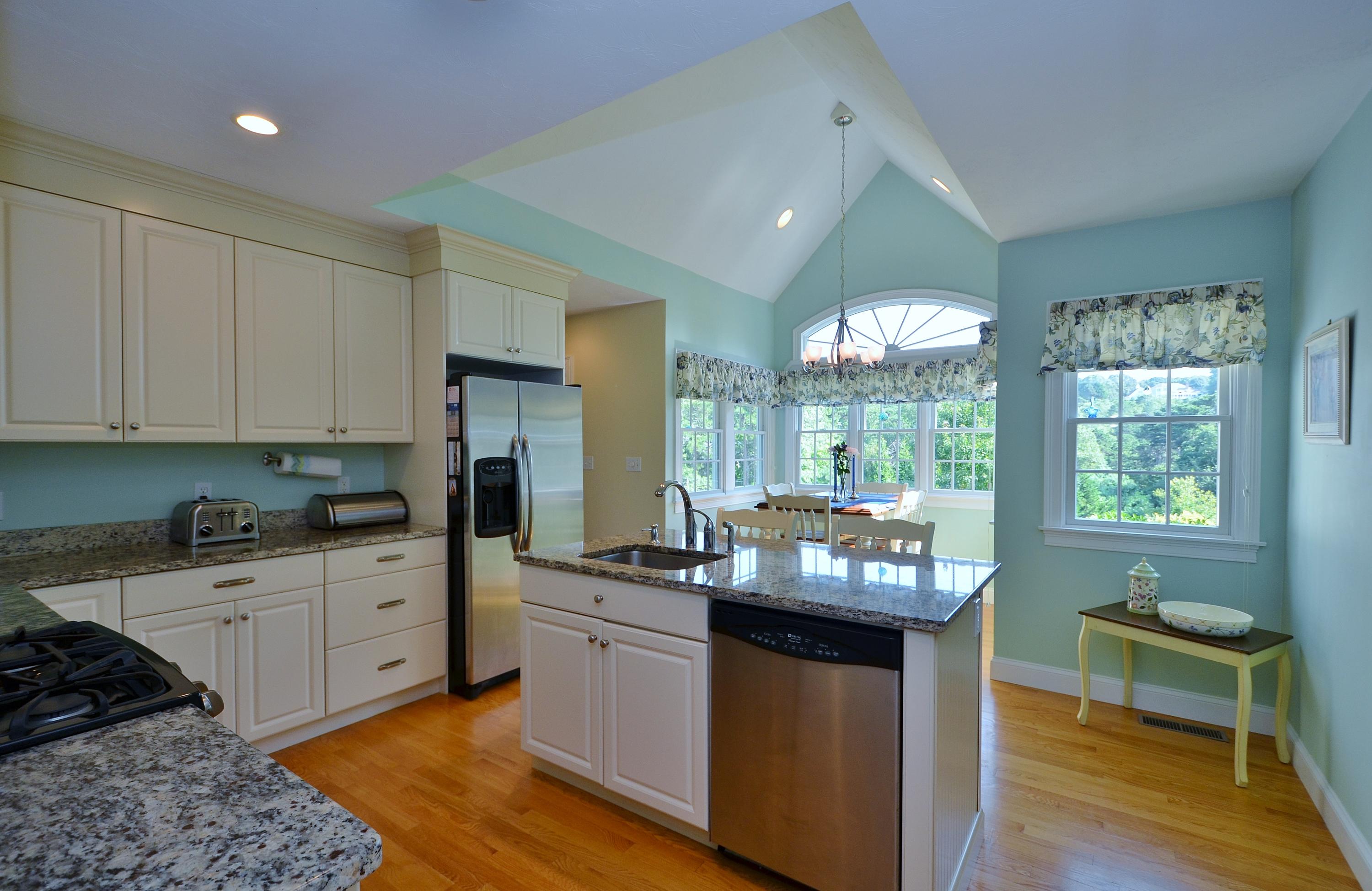 121 Cairn Ridge Road East Falmouth, MA 02536 - Photo 10 of 28 a kitchen with a sink stove and cabinets