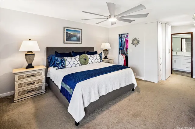 a bathroom with double vanity sink a toilet and a tub