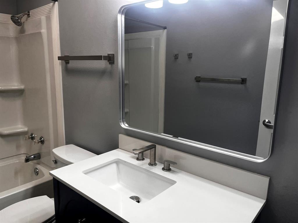 1007 Mack Place Denton, TX 76209 - Photo 35 of 37 Full bath with vanity and shower / washtub combination